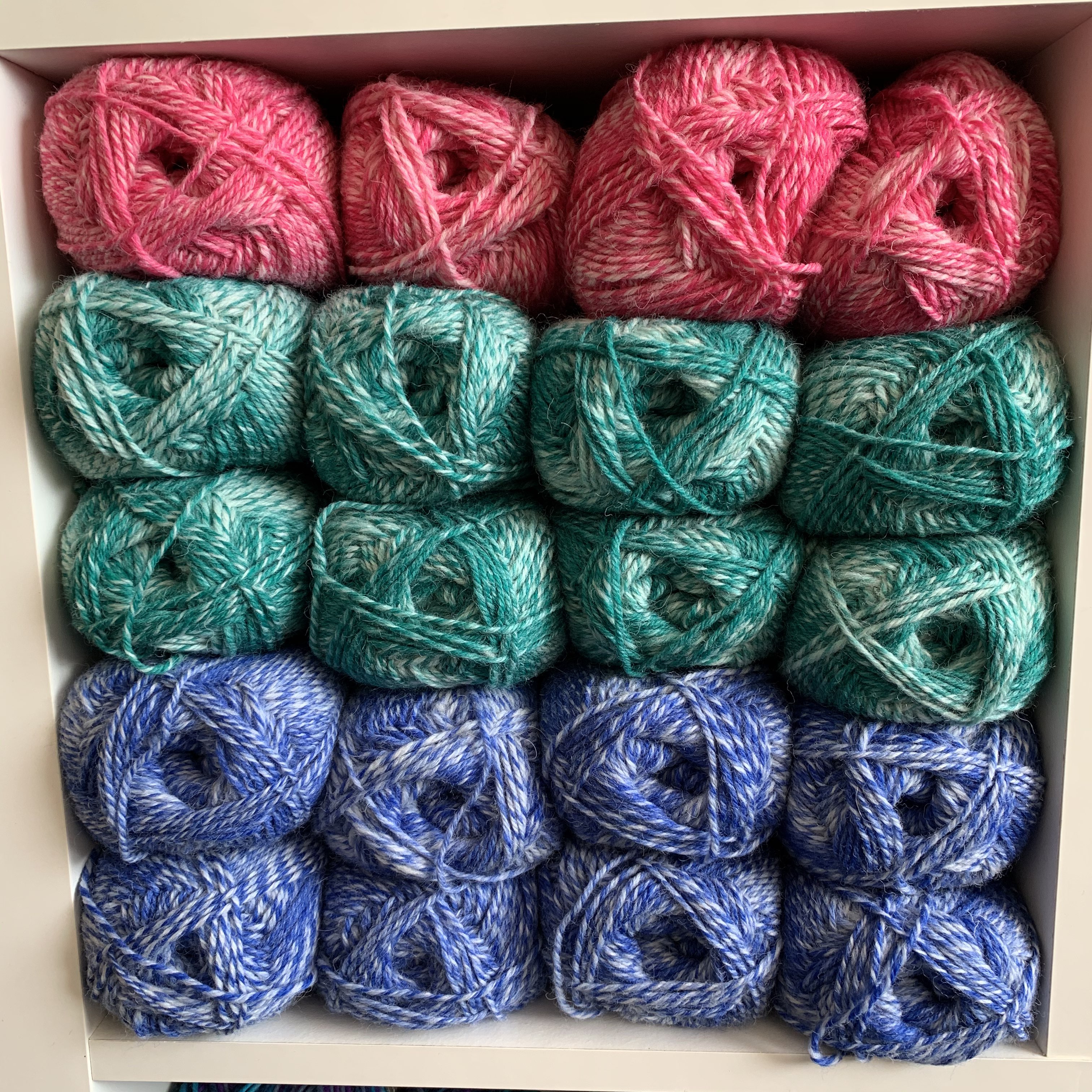 multi-coloured wool on a shelf